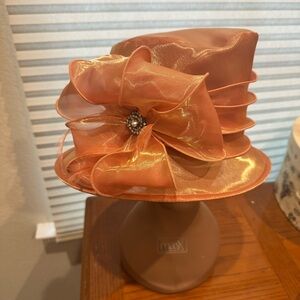 Elegant Orange Hat with Decorative Bow